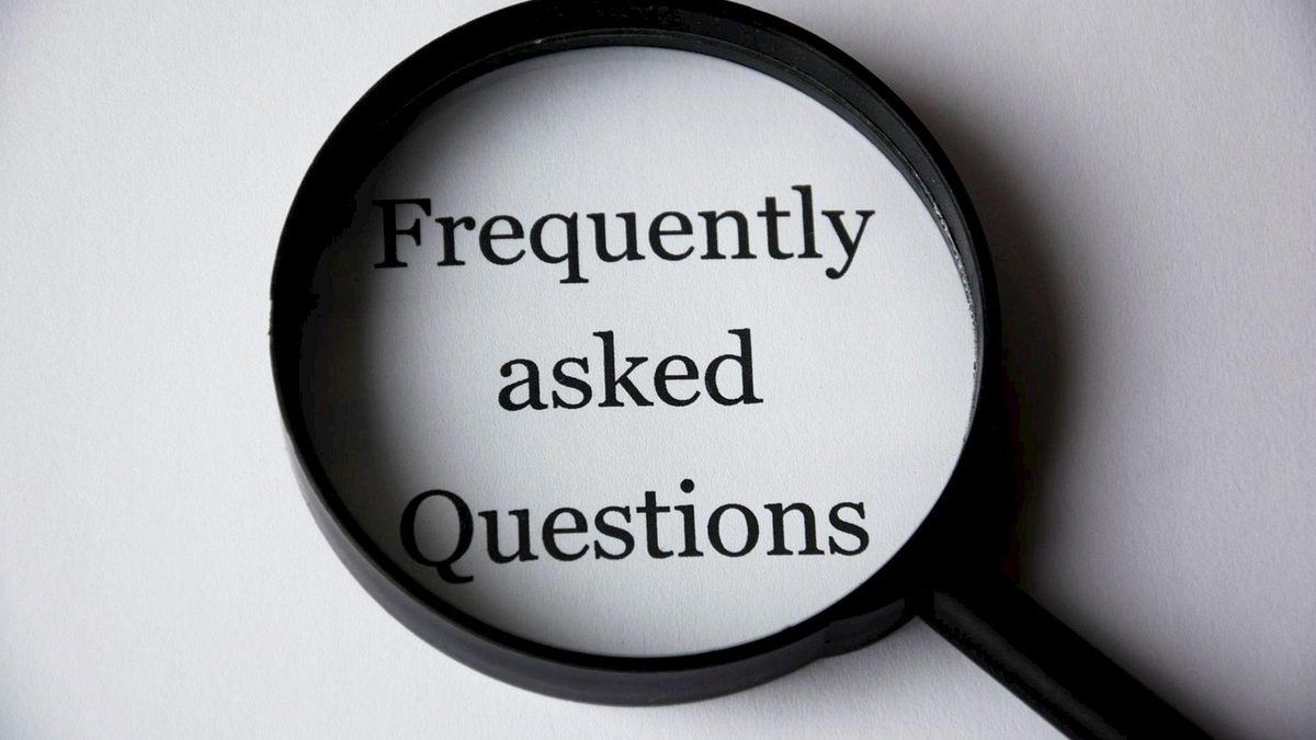 Magnifying glass over the FAQ title — frequently asked questions